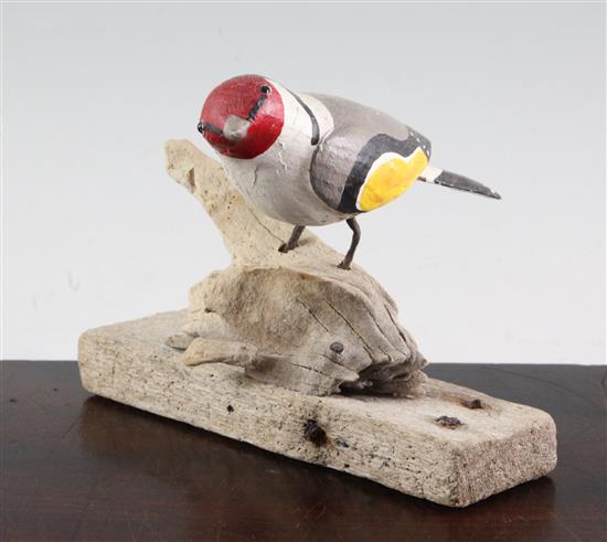 § Guy Taplin (1939-) Goldfinch perched on a stump, height 5.5in.